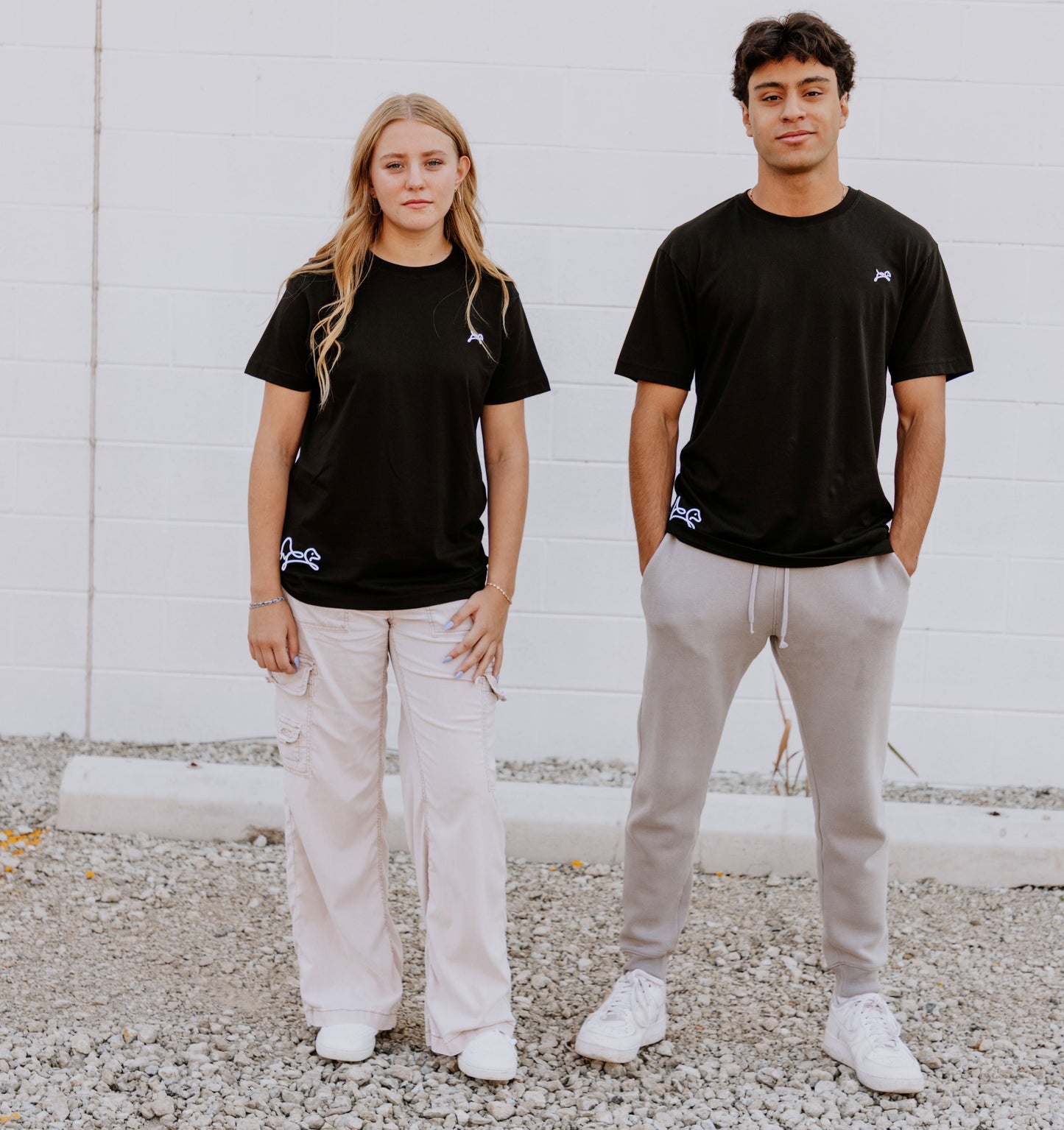 Models wearing OOsmash black T-Shirt featuring smooth fabric and flattering tailored fit.