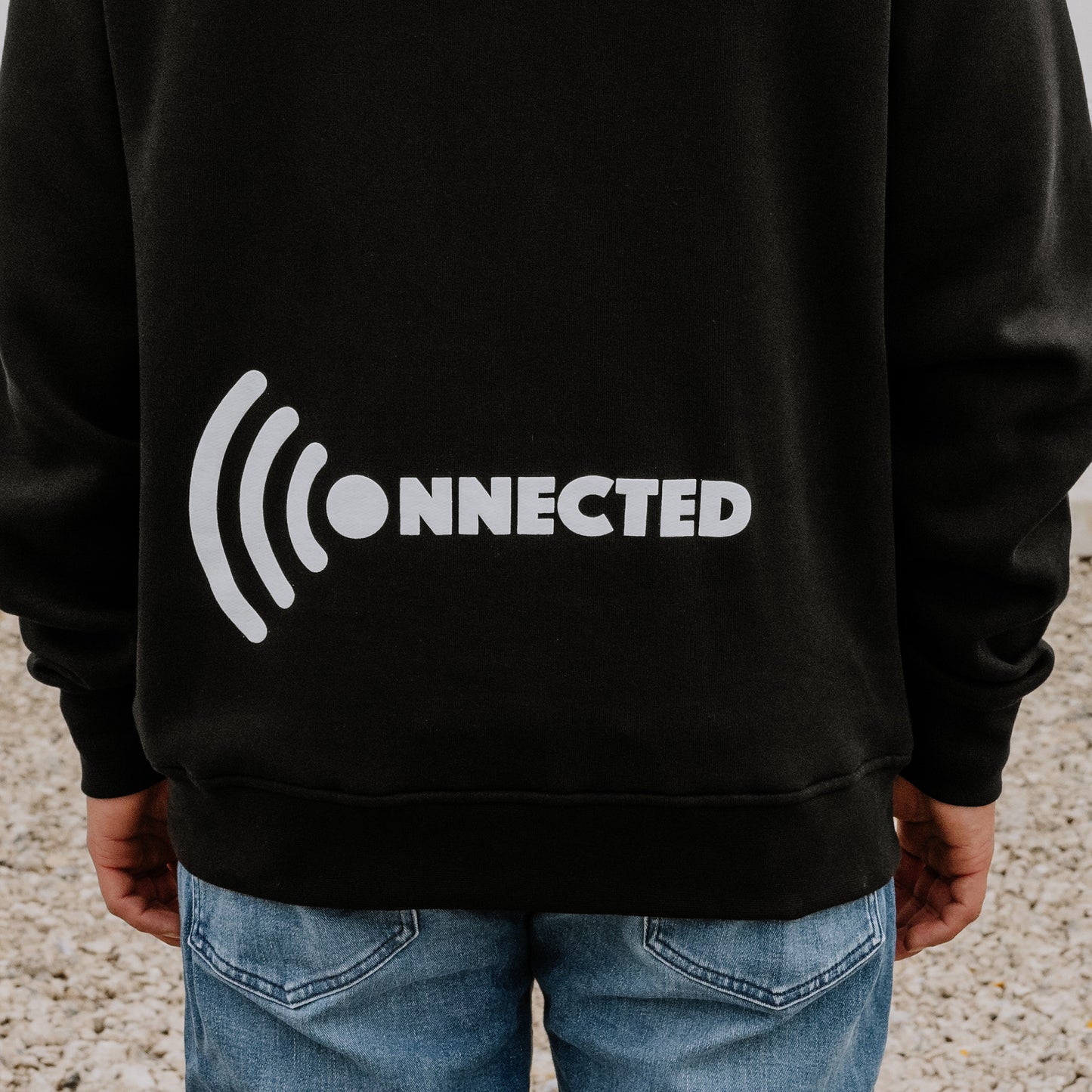 Black Men's OOsmash Connected hoodie back - WiFi signal icon graphic for teens who stay plugged in