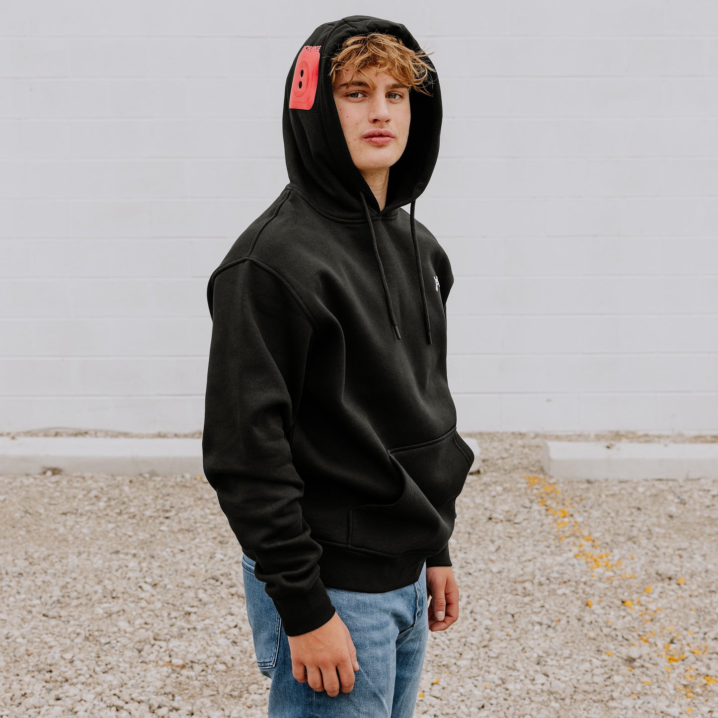 OOsmash men’s black hoodie with red plug design made from 80% cotton and 20% polyester.