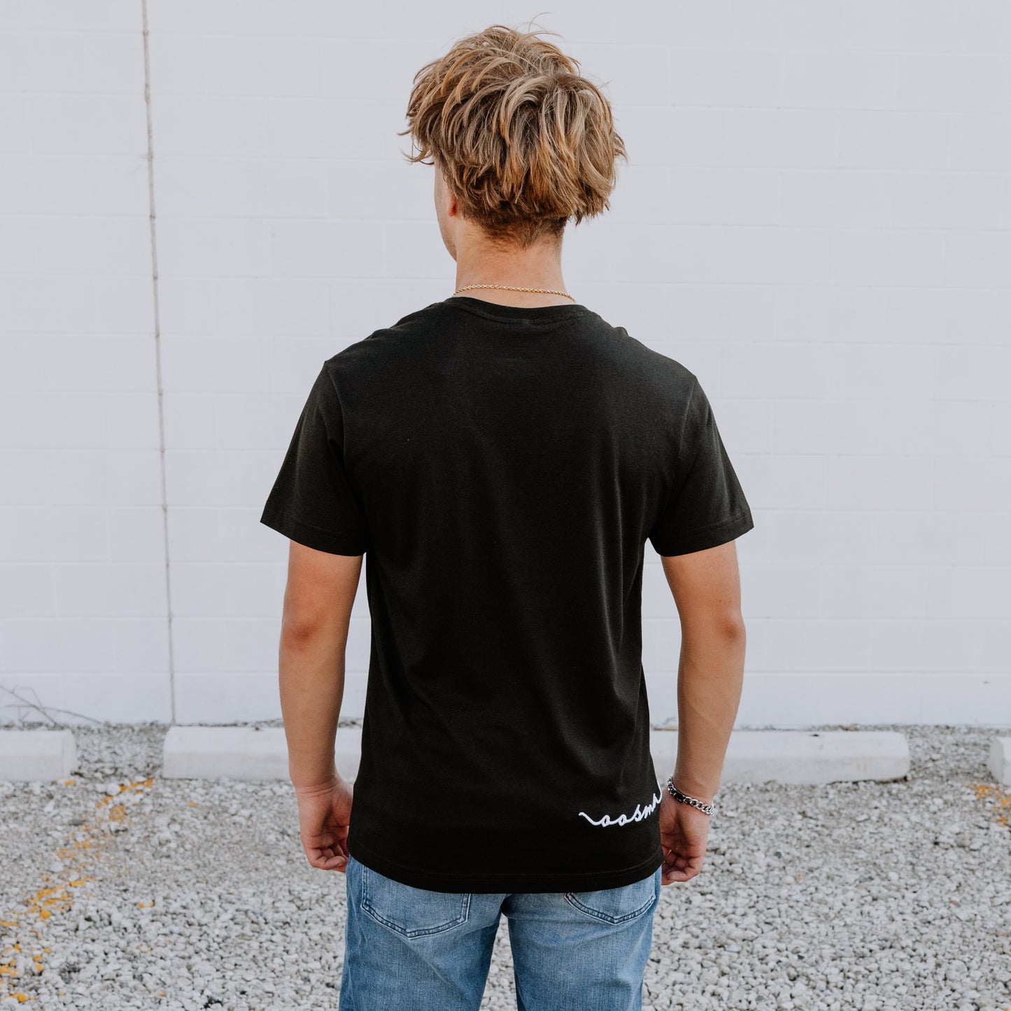 Model wearing OOsmash men’s black T-Shirt featuring premium stitching and relaxed fit.
