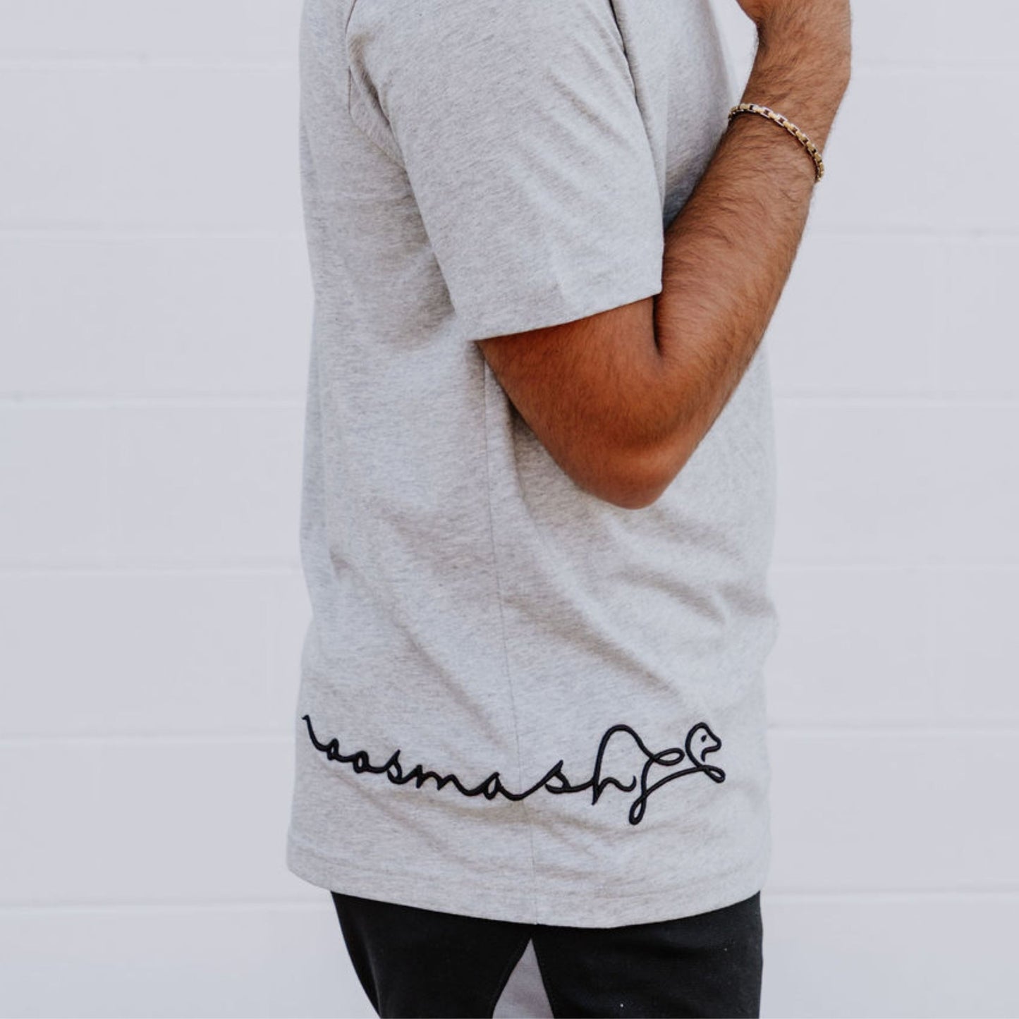 Side view of OOsmash men’s gray T-Shirt crafted from high-quality Supima cotton for comfort and durability.