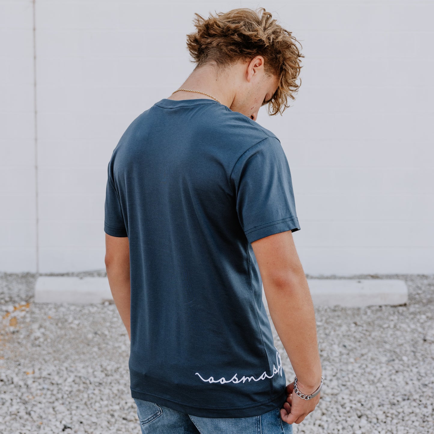 Model wearing OOsmash men’s navy blue T-Shirt featuring clean stitching and relaxed fit.