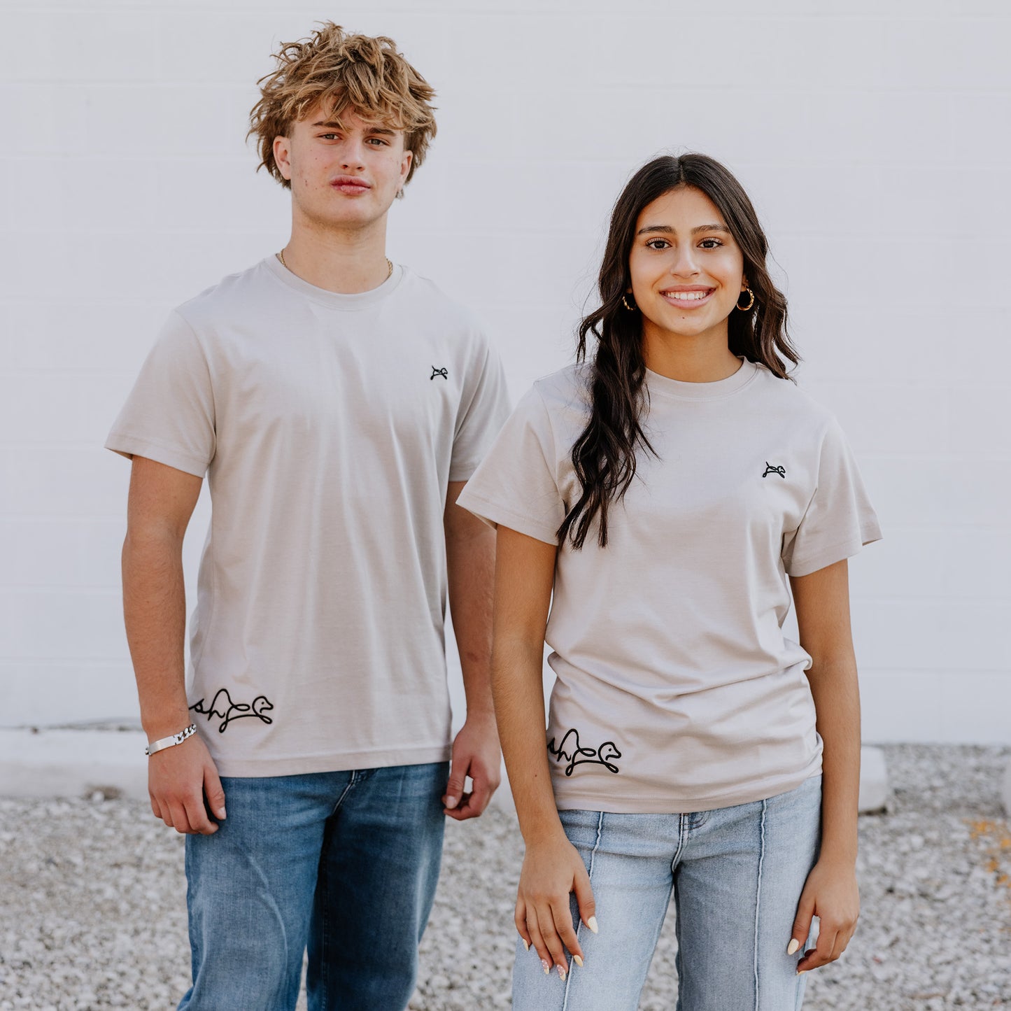 Model wearing OOsmash women’s beige T-Shirt featuring smooth fabric and flattering tailored fit.