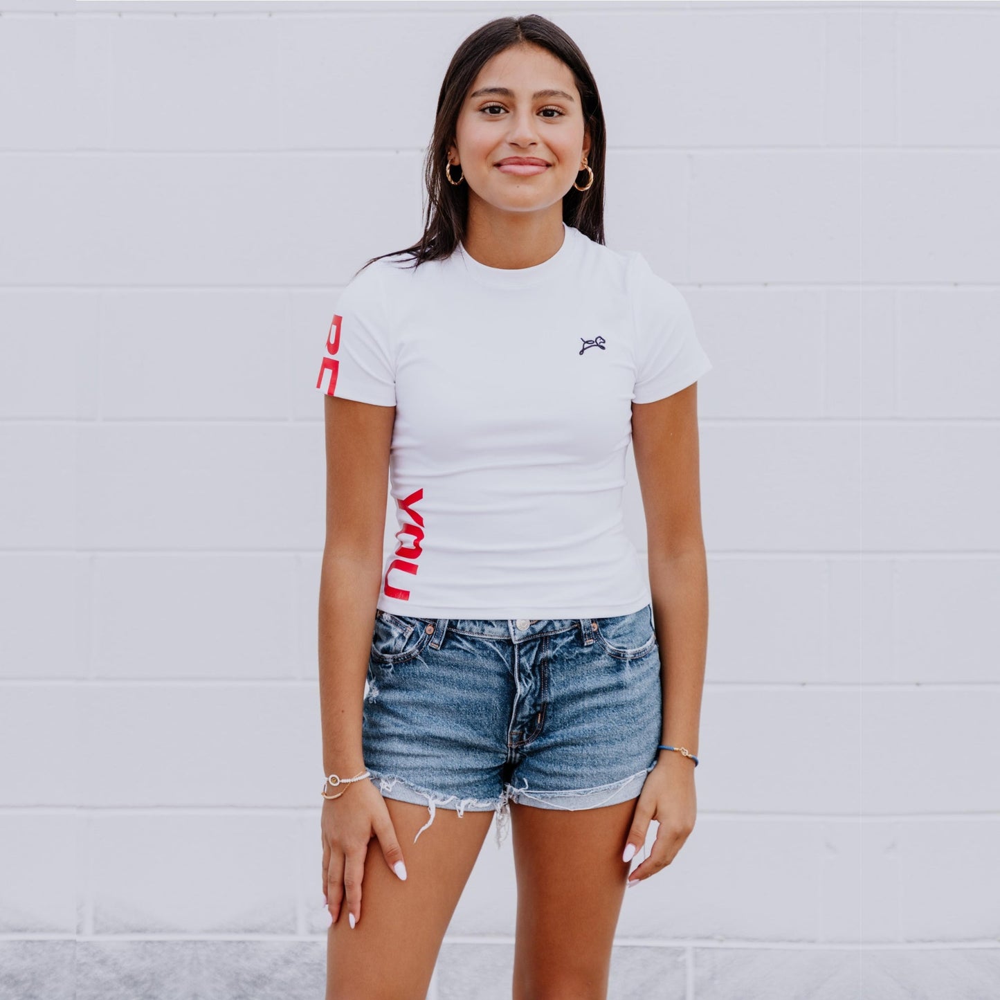 Front view of OOsmash white crop tee crafted with premium cotton-spandex blend for comfort and flexibility.