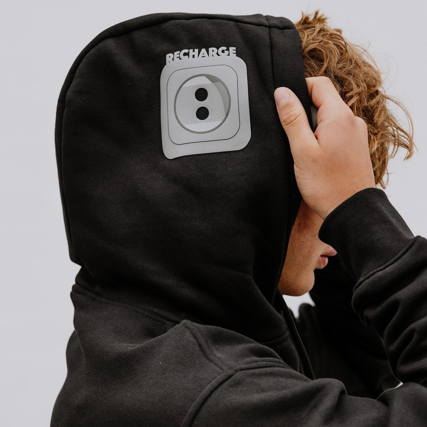 OOsmash men’s black hoodie with gray plug design, made from cotton-poly blend