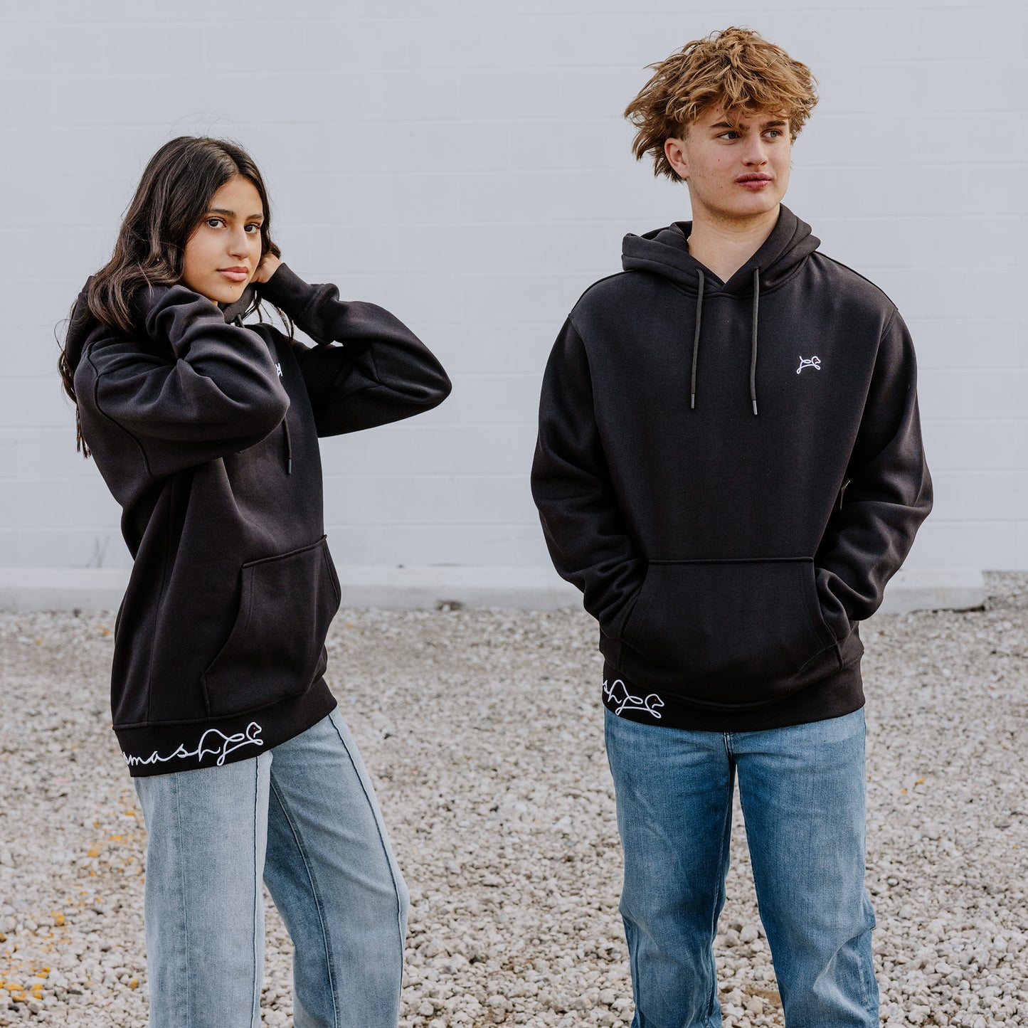 Teens owning their vibe in black OOsmash Signature hoodies - premium comfort, bold dog logo, unstoppable crew