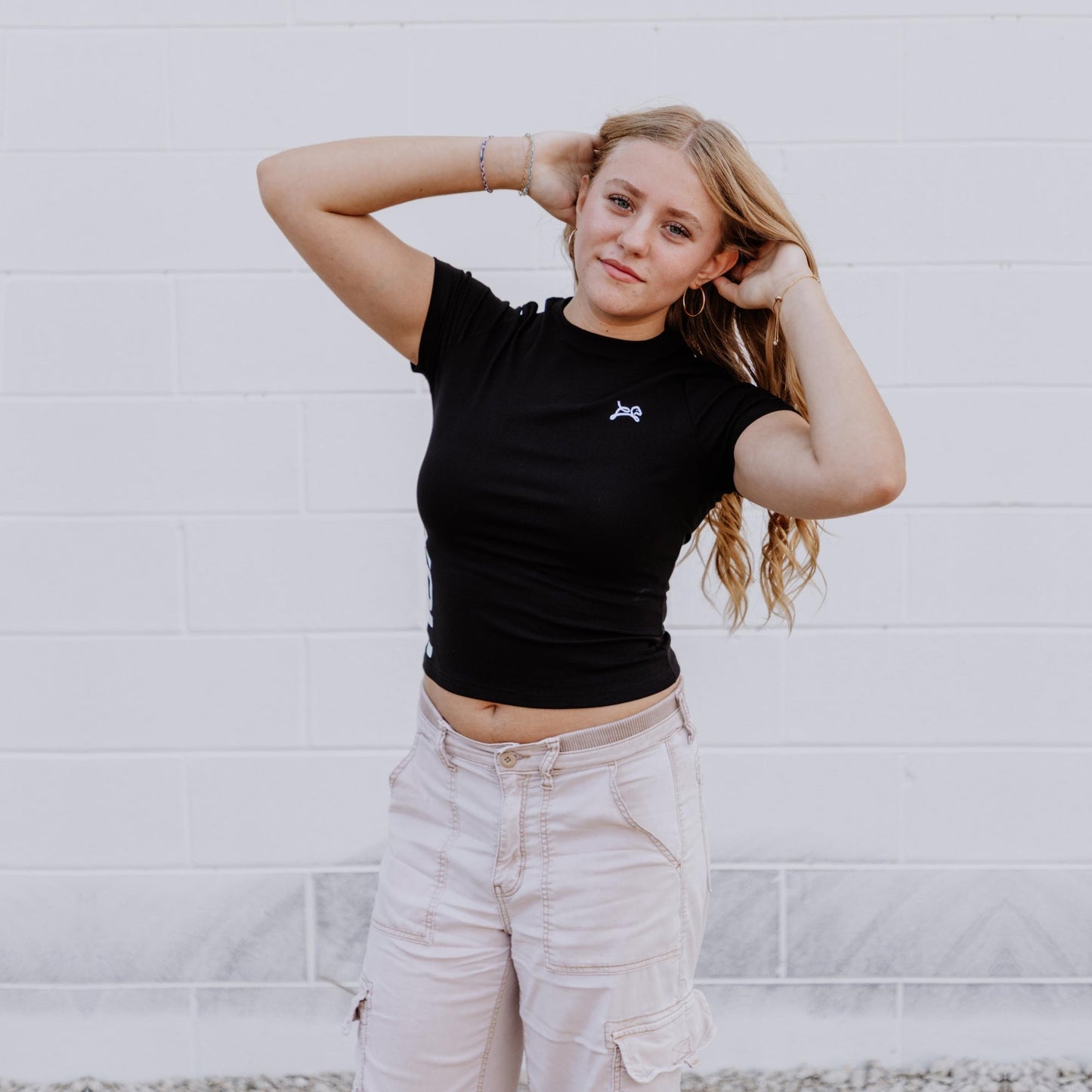 OOsmash black crop tee made from 92% cotton and 8% spandex with soft, flexible fit.