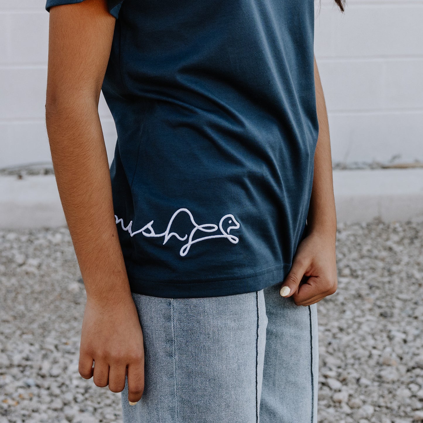 Model wearing OOsmash women’s navy blue T-Shirt featuring clean seams and comfortable fit.