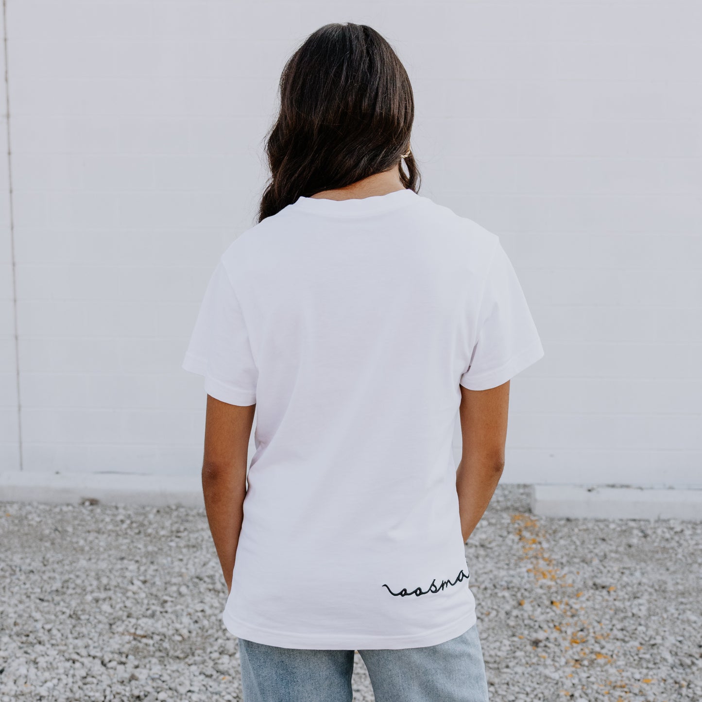Model wearing OOsmash women’s white T-Shirt featuring clean stitching and flattering fit.