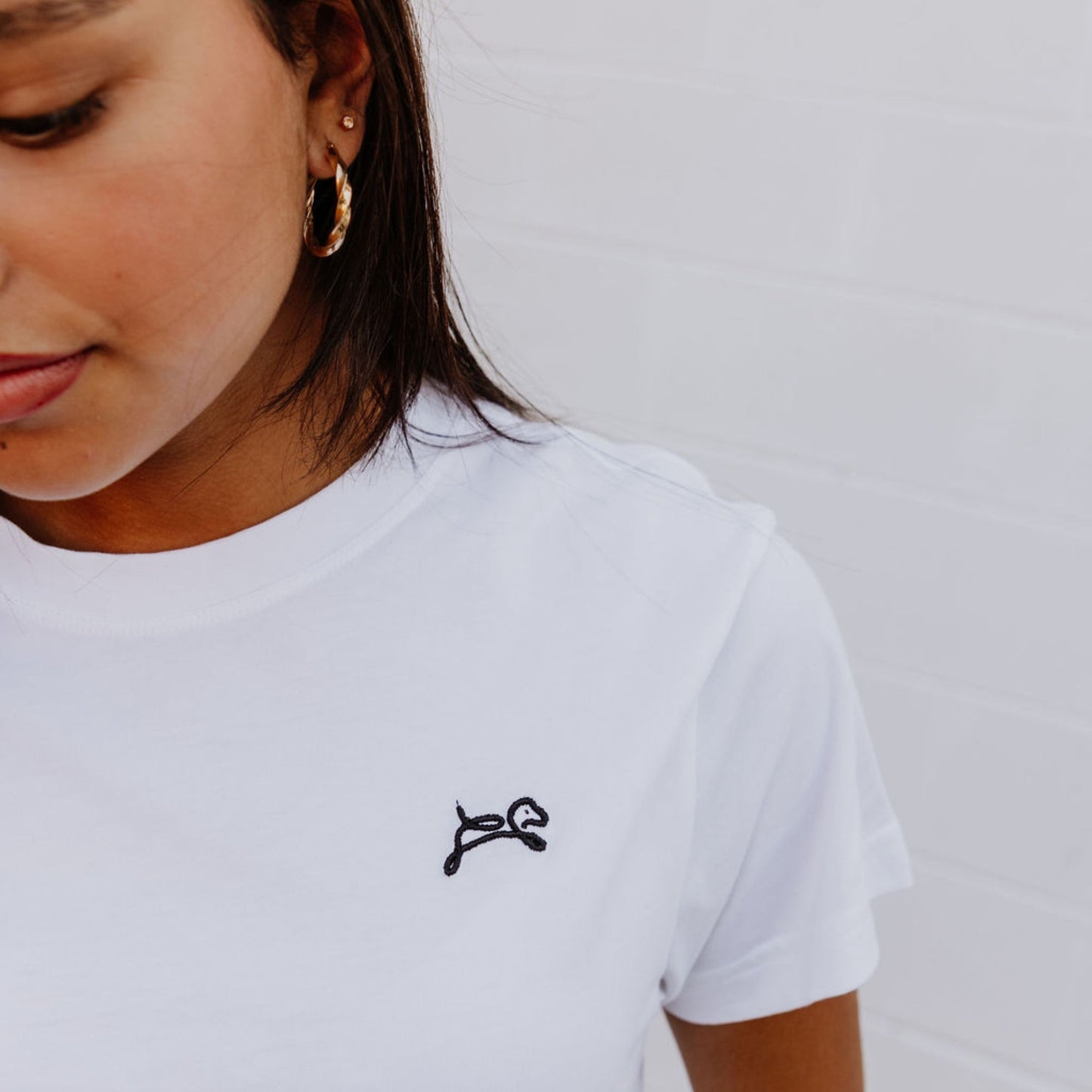 OOsmash women’s white T-Shirt made from 100% Supima cotton with soft, premium texture.