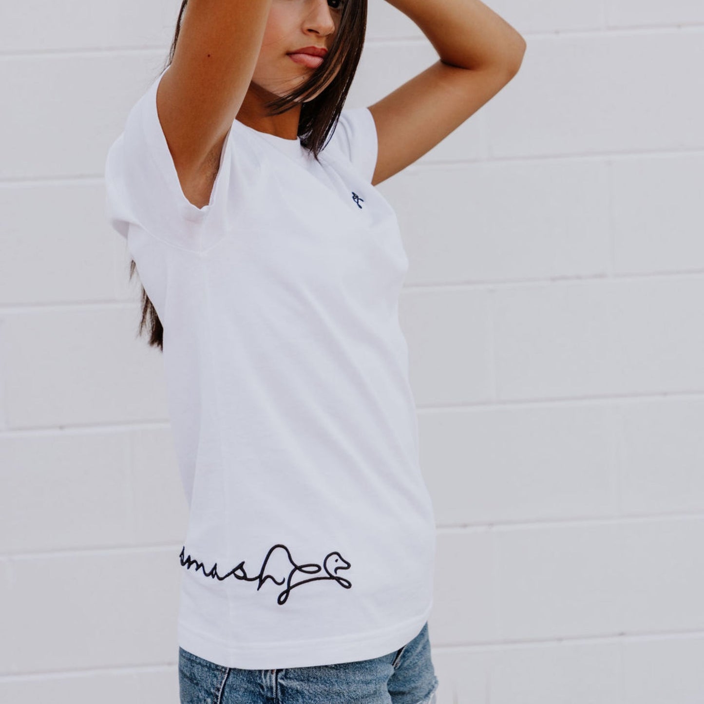 Model wearing OOsmash women’s white T-Shirt featuring clean stitching and flattering fit.