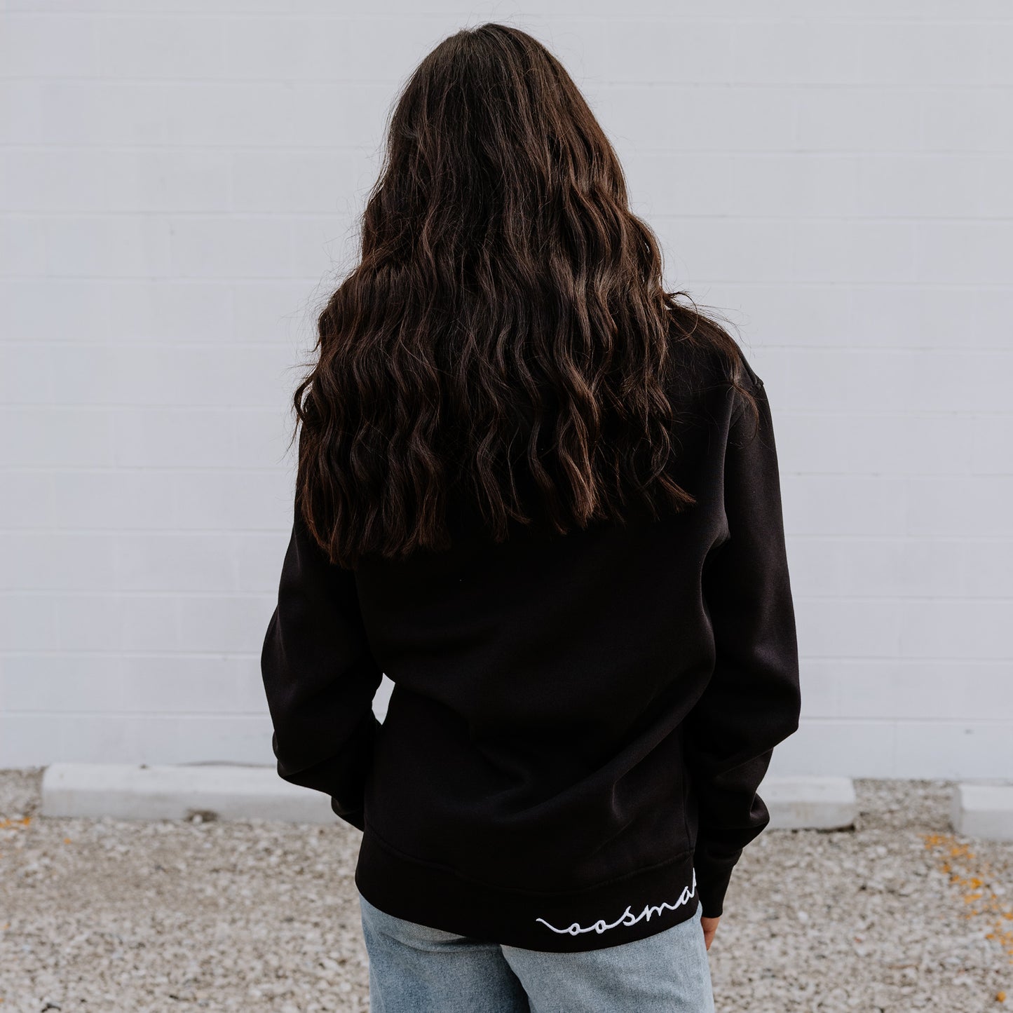 Model wearing OOsmash women’s Signature hoodie in black with soft, premium fabric.