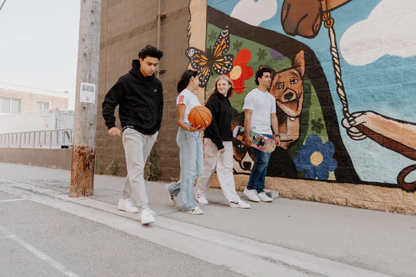Group Photo of Models Walking Wearing OOsmash Gear Hoodies and T-Shirts
