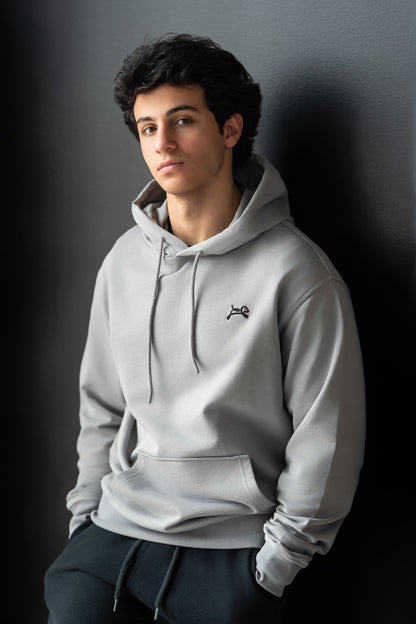 OOsmash Men's Essential Hoodie — model side view relaxed silhouette, French Terry streetwear hoodie, gift for him
