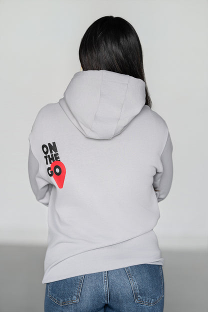 OOsmash On The Go Hoodie — women's back view, bold On The Go graphic, light gray French Terry Cotton, relaxed silhouette
