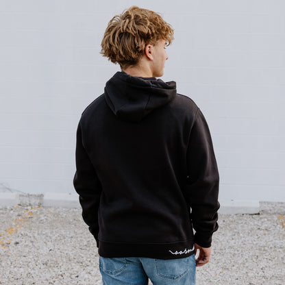 Model wearing OOsmash men’s black Signature hoodie featuring relaxed fit and adjustable hood.