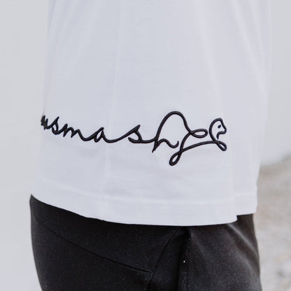 Model wearing OOsmash men’s white T-Shirt featuring clean stitching and relaxed fit.