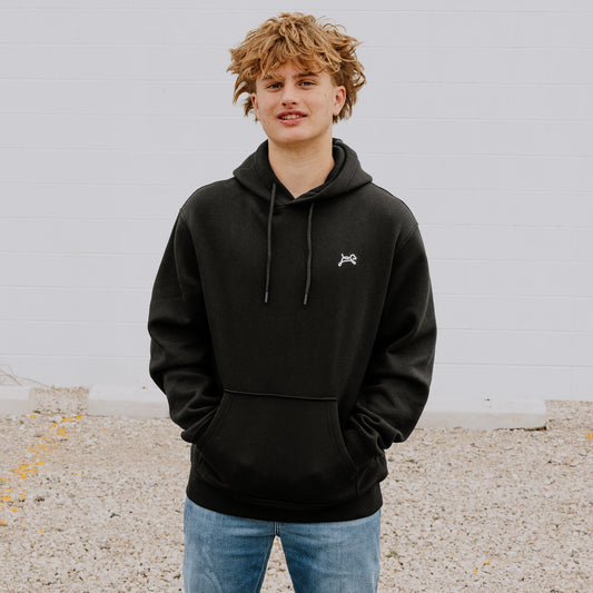 Teen wearing comfy black OOsmash hoodie with a gray plug on the hood with embroidered dog logo
