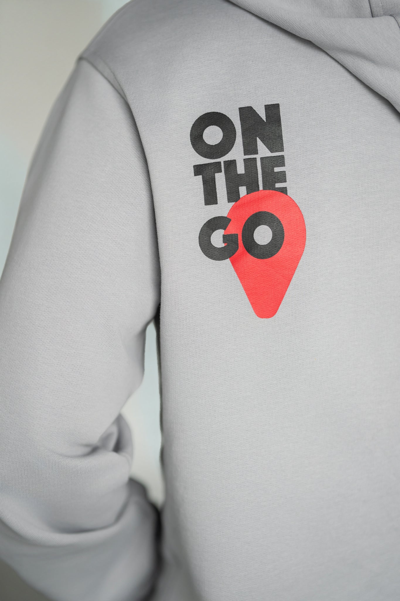 OOsmash On The Go Hoodie — close-up On The Go oversized back graphic print, bold luxury streetwear hoodie, gift for him 