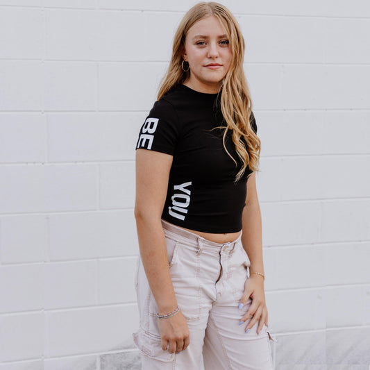 OOsmash black crop tee made from 92% cotton and 8% spandex with soft, flexible fit.