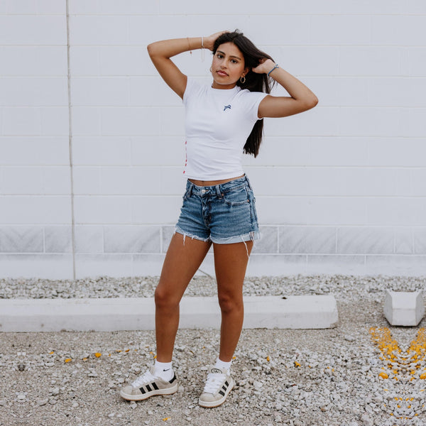 Front view of OOsmash white crop tee crafted with premium cotton-spandex blend for comfort and flexibility.