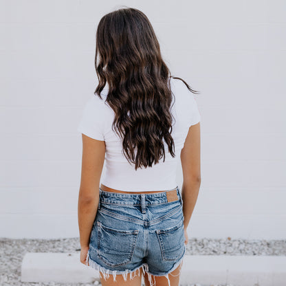 Back view of OOsmash white crop tee crafted with premium cotton-spandex blend for comfort and flexibility.