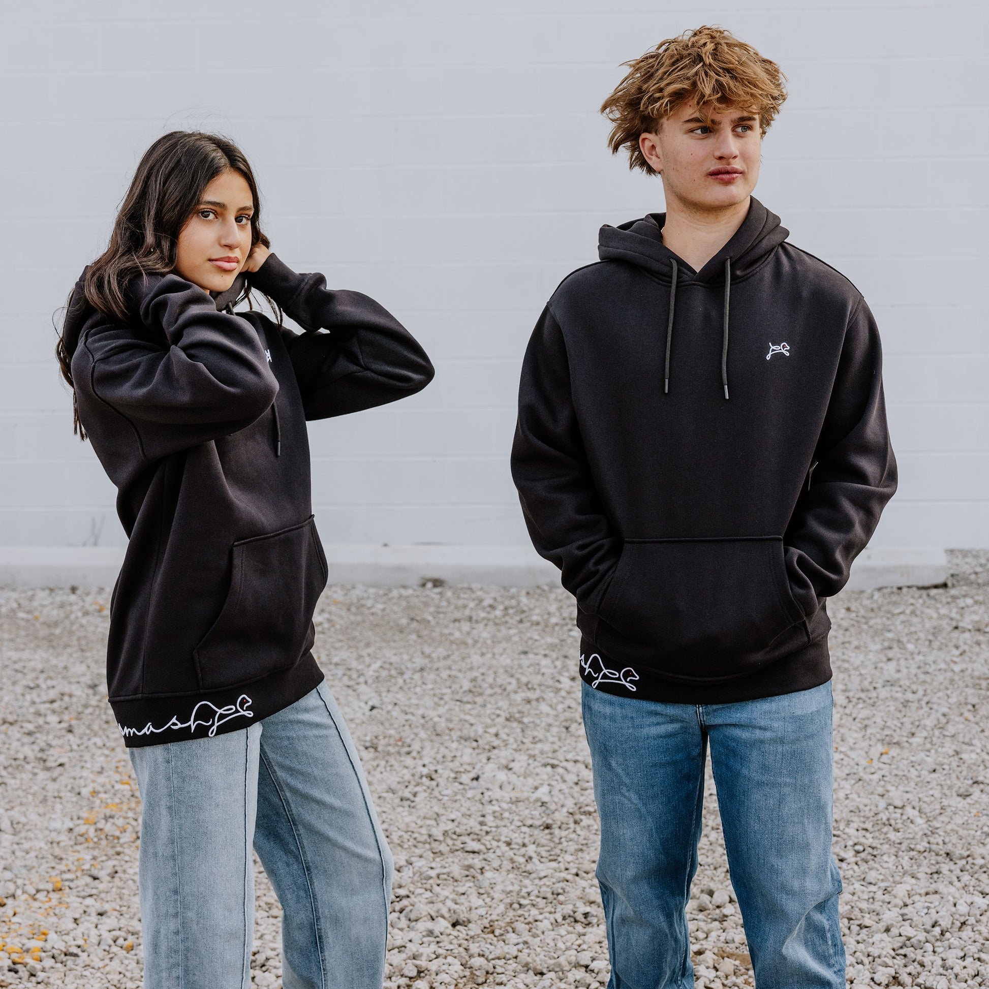 Teens owning their vibe in black OOsmash Signature hoodies - premium comfort, bold dog logo, unstoppable crew
