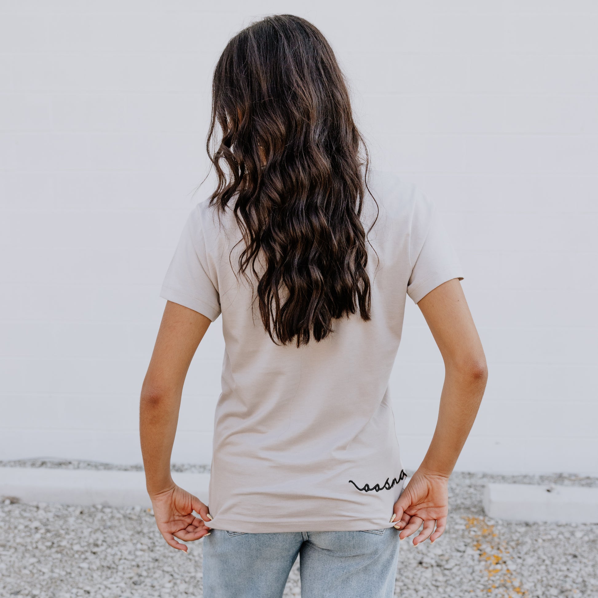 Model wearing OOsmash women’s beige T-Shirt featuring smooth fabric and flattering tailored fit.