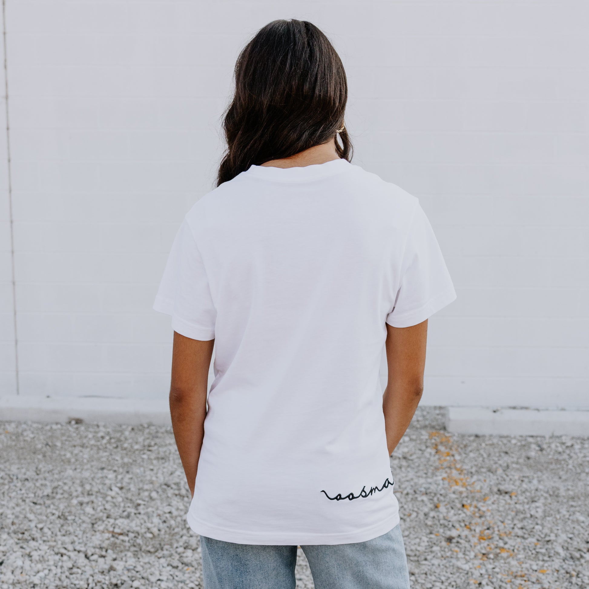 Model wearing OOsmash women’s white T-Shirt featuring clean stitching and flattering fit.