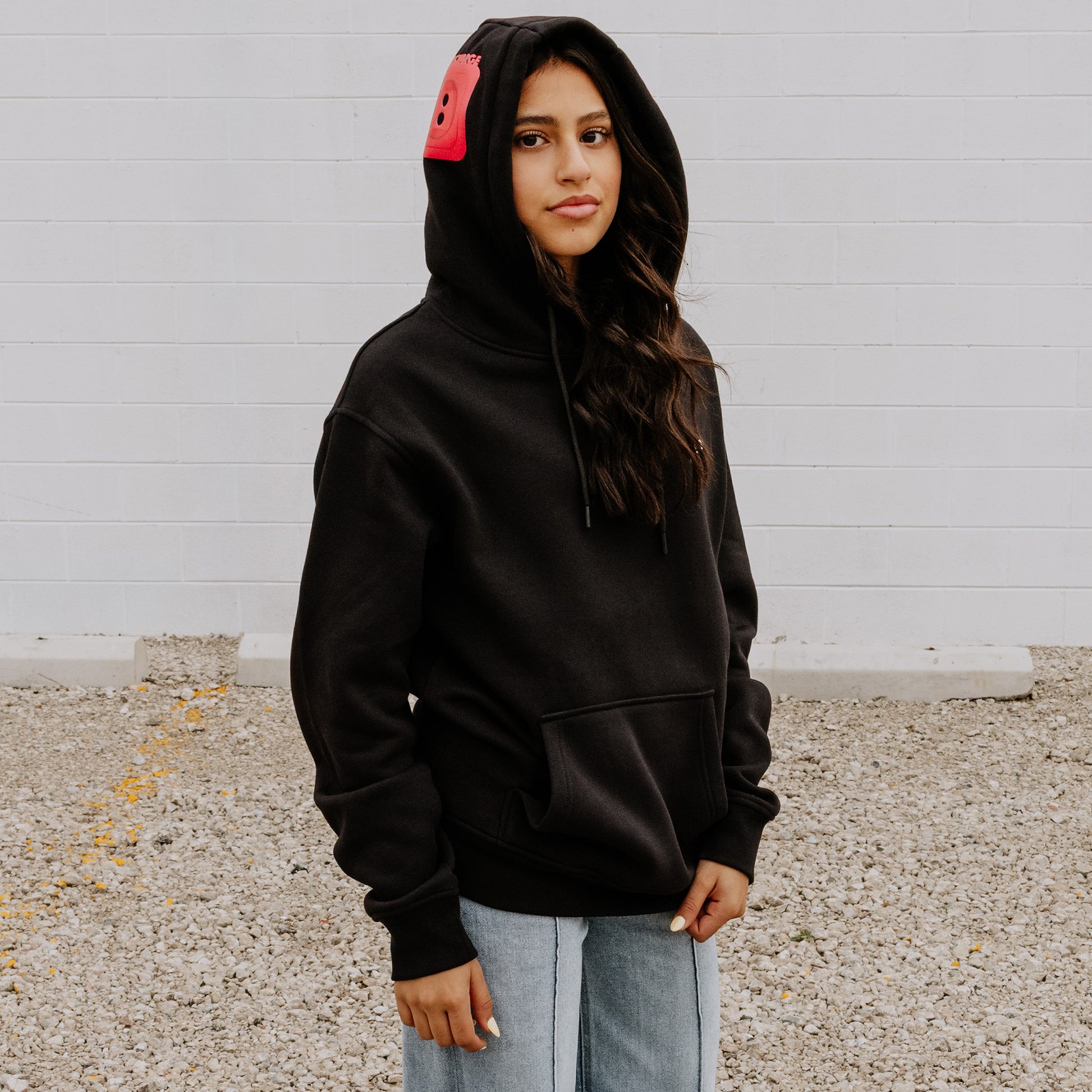 Women's Black OOsmash Plug Hoodie with red European plug design on hood - bold confidence, premium style
